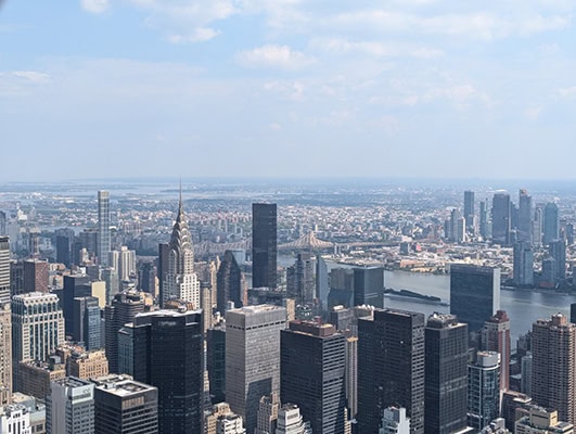 Towering buildings separated by a river