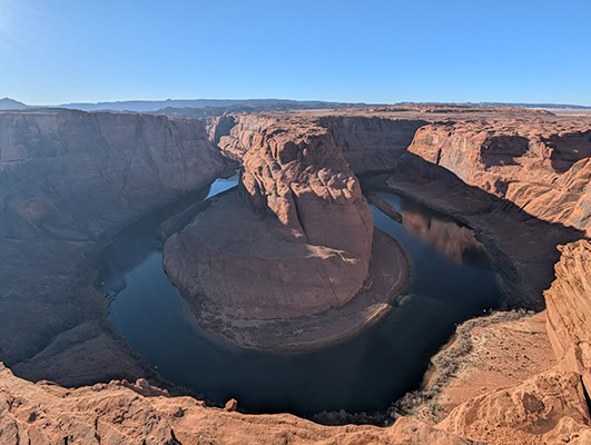 The Colorado River makes a horseshoe-shaped turn at the bottom of Glen Canyon